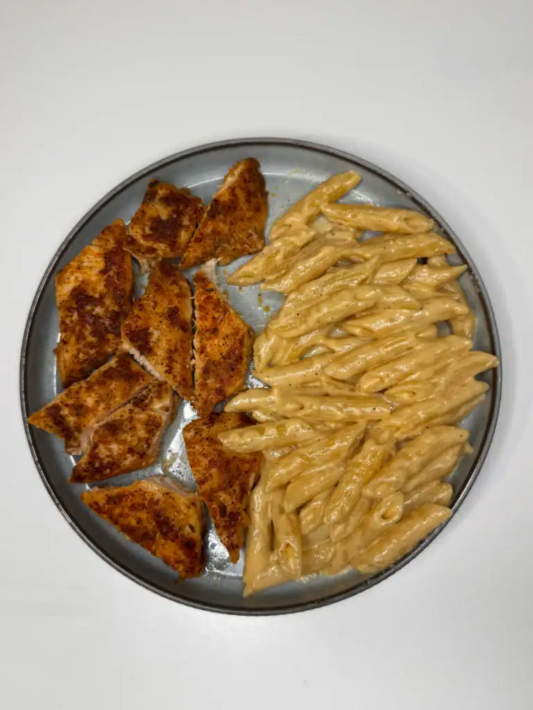 Creamy garlic Parmesan chicken pasta with seasoned chicken breast and penne pasta